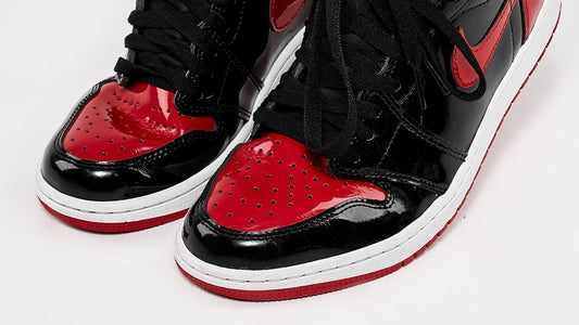Jordan 1 Patent Bred with Crease Protectors installed in one shoe. 